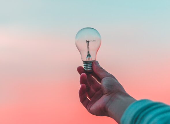 person holding light bulb